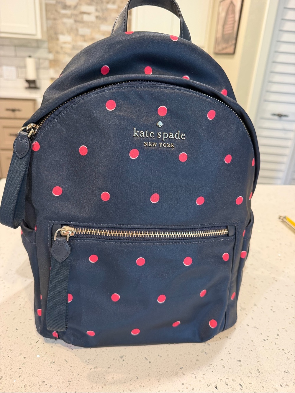 kate spade navy backpack with hot pink polka dots